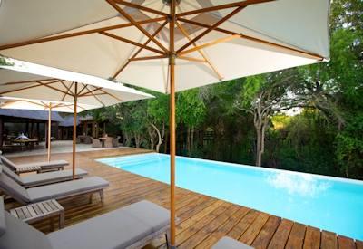 Swimming pool with sun loungers