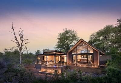 Suite and villa at night with plunge pools