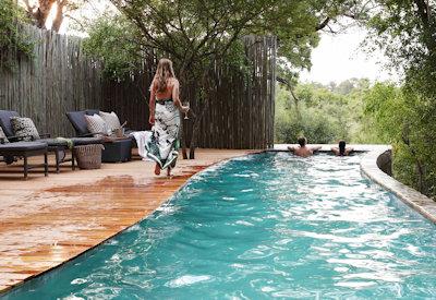 Swimming pool surrounded by bushveld architecture