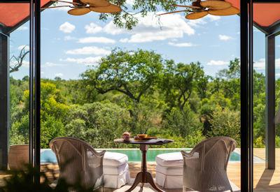 Plunge pool surrounded by African wilderness