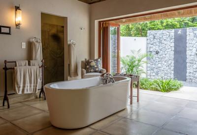 En-suite bathroom with free standing baths