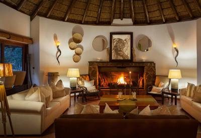 Thatched lounge area and fireplace