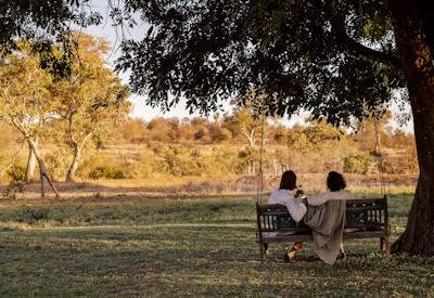 Various outdoor decks overlook a dry river bed