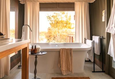 Outside shower and beautiful freestanding bath