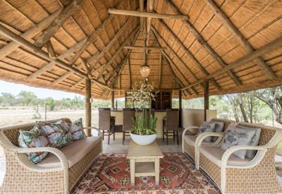 Outdoor thatched bar and lounge area