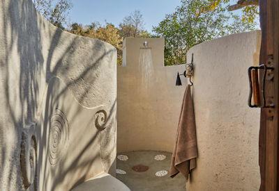 En-suite bathrooms with indoor and outdoor showers
