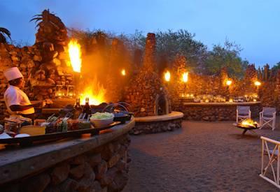 Outdoor boma and dining area at Phinda Mountain