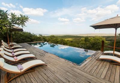 Swimming pool with sun loungers and viewing deck