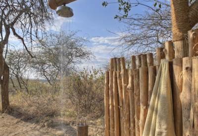 Outdoor showers at camp