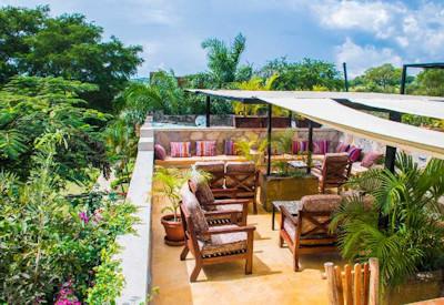 Dining and lounge area surrounded by huge garden