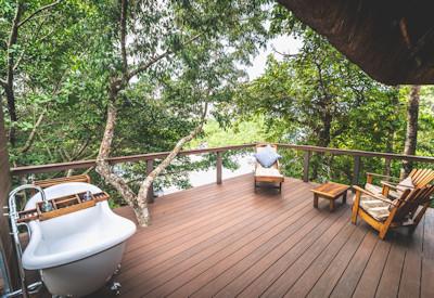 Outdoor bath tub on a private island mid stream