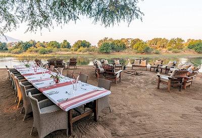 Outdoor dining at camp overlooking the mighty Zambezi River