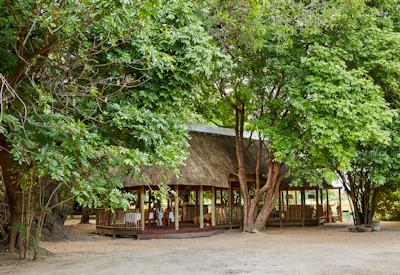 Surrounded by shady trees offering an authentic charm