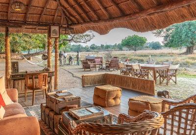 Thatched lounge area overlooking a permanent oxbow lagoon