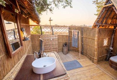 Outdoor bathrooms facilities near a resident hippo pod