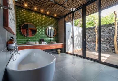 Private bathroom with free standing bathtub