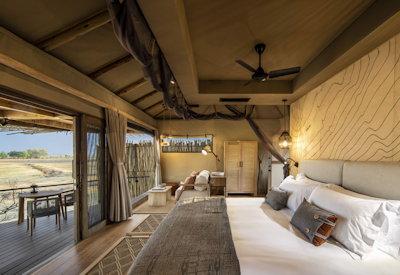 Safari suites with a view of the camp's private watering hole
