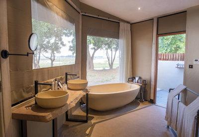 En-suite bathrooms under a sausage tree