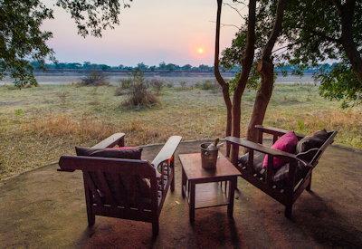 South Luangwa armchair safari under a grove of mahogany trees