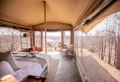 Tented suites on a ridge overlooking the wilds of Africa