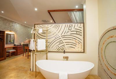 Large en-suite bathrooms with bath and double shower