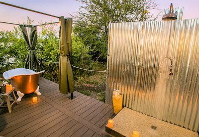 Outdoor shower and bathtub