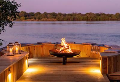 Firepit at sunset overlooking the Zambezi River