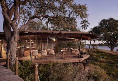 Private rooftop sitting area surrounded by a natural environment