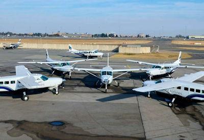 Light aircraft parked on the apron at O.R. Tambo before the shuttle flight to Madikwe Game Reserve