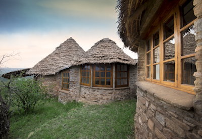 andBeyond Klein's Camp local stone makuti thatched chalet Kuka Hills Serengeti Tanzania