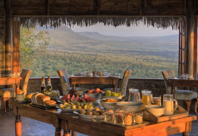 andBeyond Klein's Camp open fireplace dining room garden produce Kuka Hills Tanzania