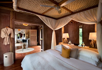 andBeyond Lake Manyara Tree Lodge beautifully appointed bedroom mosquito nets Tanzania