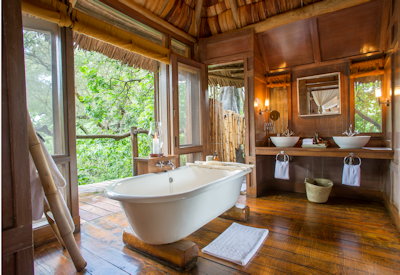 andBeyond Lake Manyara Tree Lodge en-suite freestanding bath indoor outdoor shower Tanzania