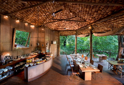 andBeyond Lake Manyara Tree Lodge open central guest area wildlife literature Tanzania