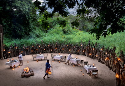 andBeyond Lake Manyara Tree Lodge outdoor boma dinner under African stars Tanzania