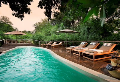 andBeyond Lake Manyara Tree Lodge swimming pool deck chairs Lake Manyara Tanzania