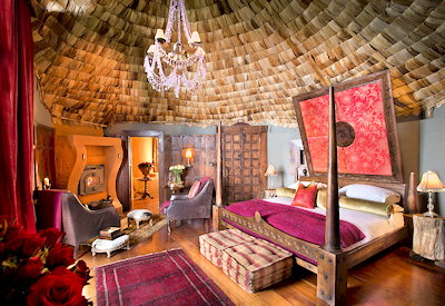 andBeyond Ngorongoro Crater Lodge absolute luxury antiques Persian rugs fireplace Tanzania
