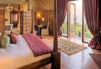 andBeyond Ngorongoro Crater Lodge luxurious suite banana leaf roof outdoor decking Tanzania