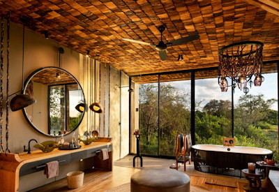 andBeyond Grumeti River Lodge en-suite bathroom freestanding bath indoor shower Tanzania