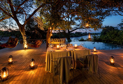 andBeyond Grumeti River Lodge outdoor dining rim-flow swimming pool Serengeti Tanzania