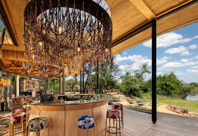 andBeyond Grumeti River Lodge main bar area Grumeti River views pizza oven boma Tanzania