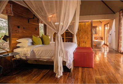 Sayari Camp luxurious tented bedroom king bed freestanding bath private veranda Tanzania