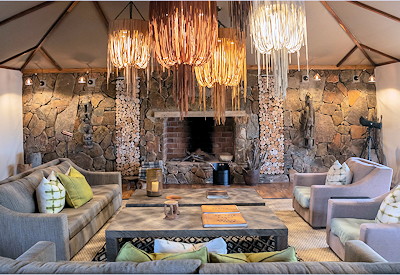Sayari Camp luxurious lounge area bar cosy library Serengeti Tanzania Asilia