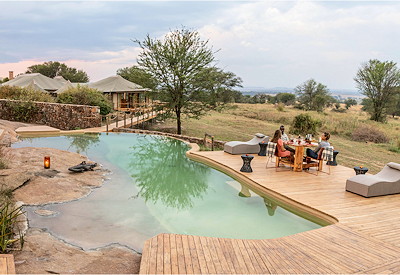Sayari Camp rim-flow swimming pool northern Serengeti wildlife views Tanzania