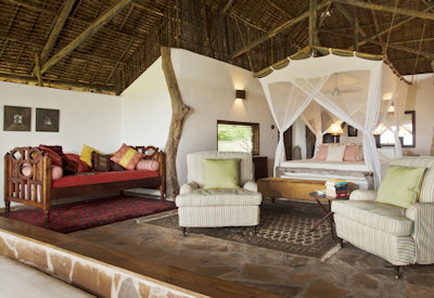 Beho Beho Camp large stone palm-thatched banda private dressing room en-suite Tanzania