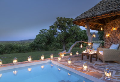 Beho Beho Camp plunge pool lantern night Selous Game Reserve Tanzania