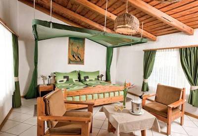 Dik Dik Hotel large bedroom hammock private balcony mini-bar mosquito net Tanzania