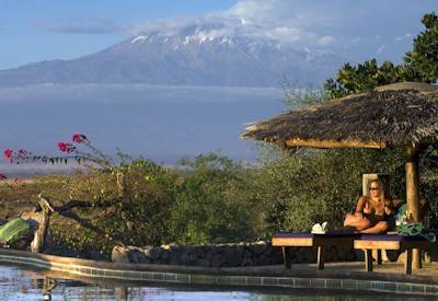 KIA Lodge hilltop pool 360-degree Kilimanjaro Meru Blue Mountains Maasai Plains views Tanzania