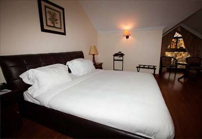 Kibo Palace Hotel beautifully appointed bedroom African décor air conditioning Tanzania