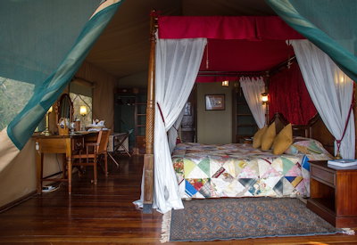 Kirawira Serena Camp Edwardian four-poster bed writing desk private deck Tanzania
